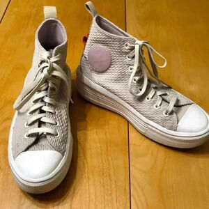 Converse Chuck Taylor all-star high top cream colored lace up platform sneakers.